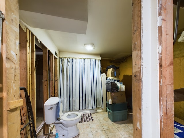 bathroom featuring tile patterned floors and toilet