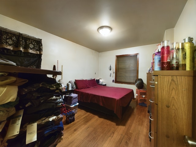 bedroom with hardwood / wood-style floors