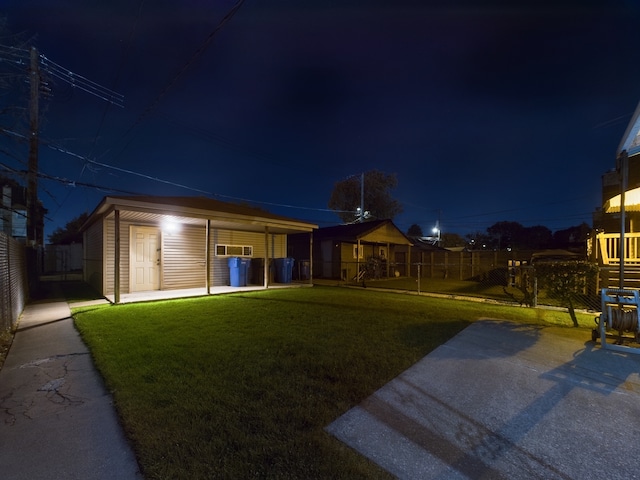 view of front of home featuring a carport and a lawn