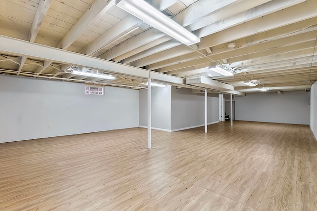 basement featuring light wood-type flooring