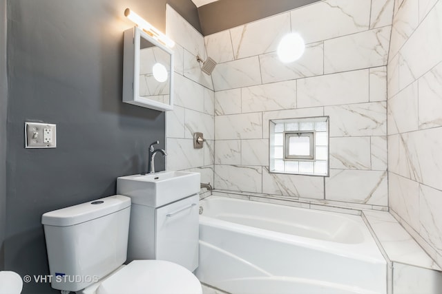 full bathroom with vanity, toilet, and tiled shower / bath combo