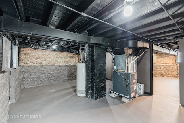 basement featuring gas water heater and heating unit