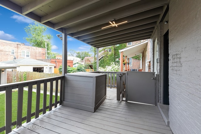 wooden deck with a yard