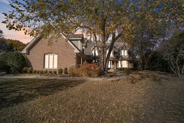 view of front of property with a lawn