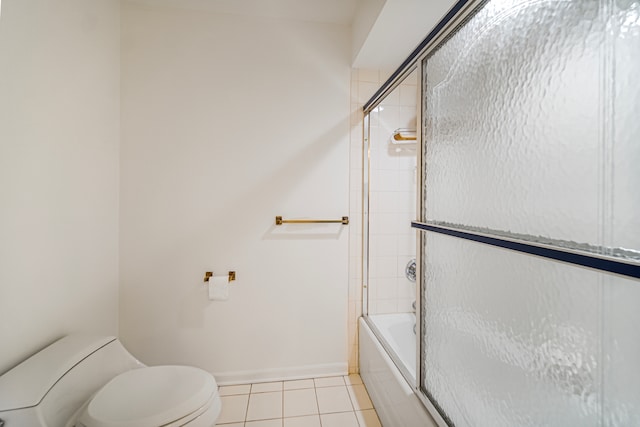 bathroom with toilet, shower / bath combination with glass door, and tile patterned flooring