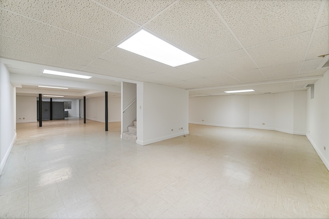 basement featuring a drop ceiling