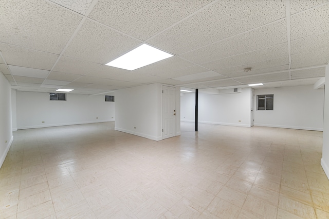 basement featuring a drop ceiling