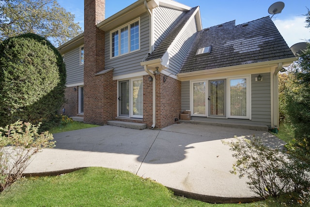 rear view of property featuring a patio area