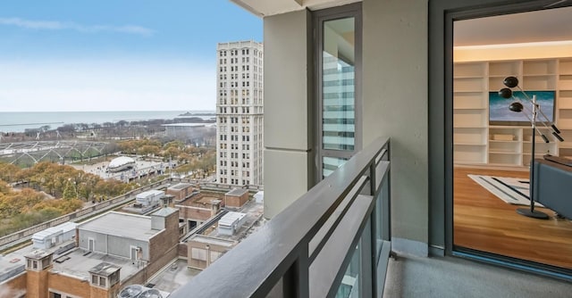 balcony featuring a water view