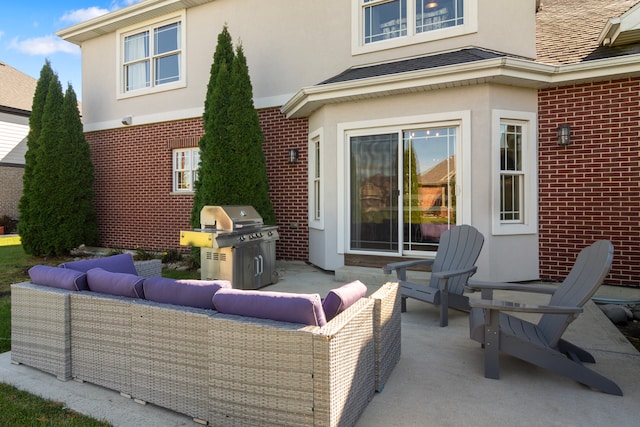 view of patio with grilling area and an outdoor hangout area