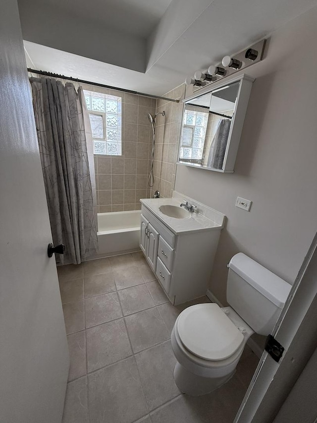 full bathroom featuring shower / bath combo, vanity, toilet, and plenty of natural light