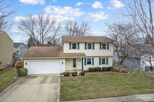 front of property with a garage and a front lawn