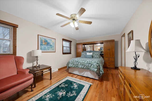 bedroom with hardwood / wood-style floors and ceiling fan