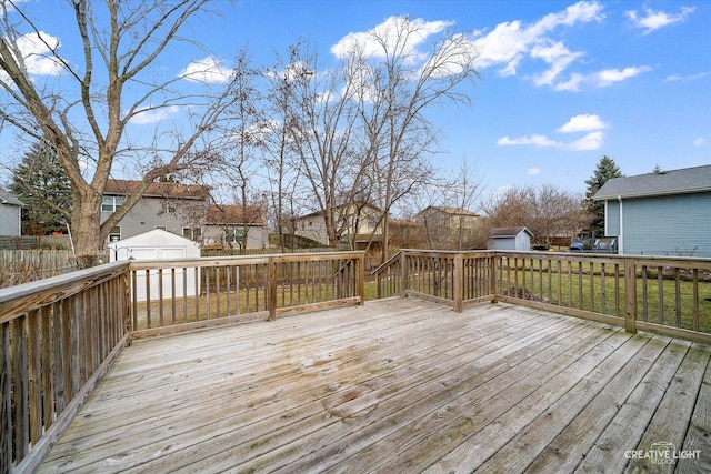 wooden terrace with an outbuilding