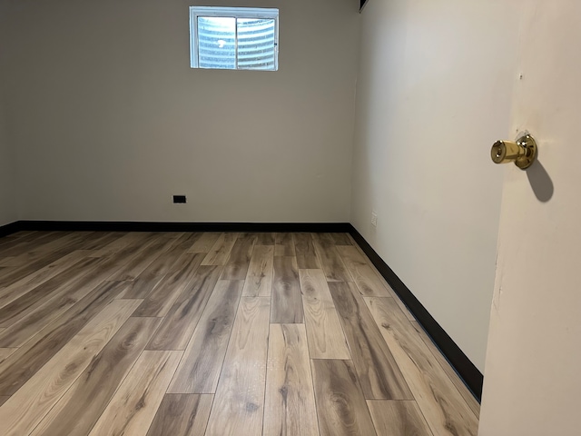 basement featuring light hardwood / wood-style flooring