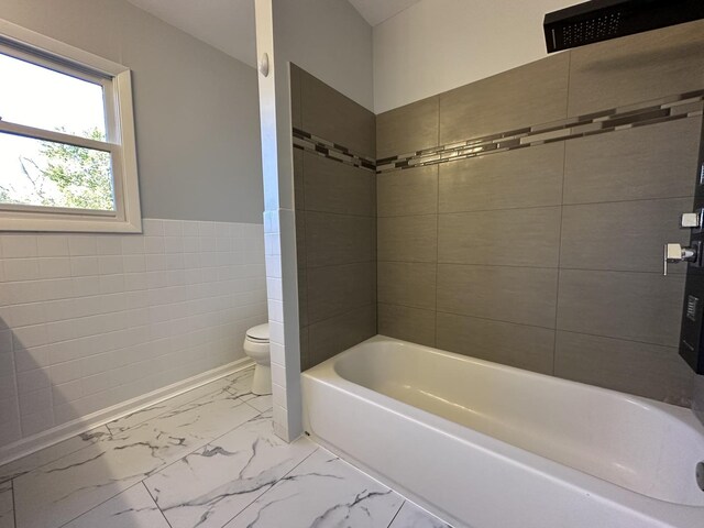 225 Pleasure Dr, Mundelein, IL 60060 - bathroom with tile walls, wainscoting, toilet, and marble finish floor