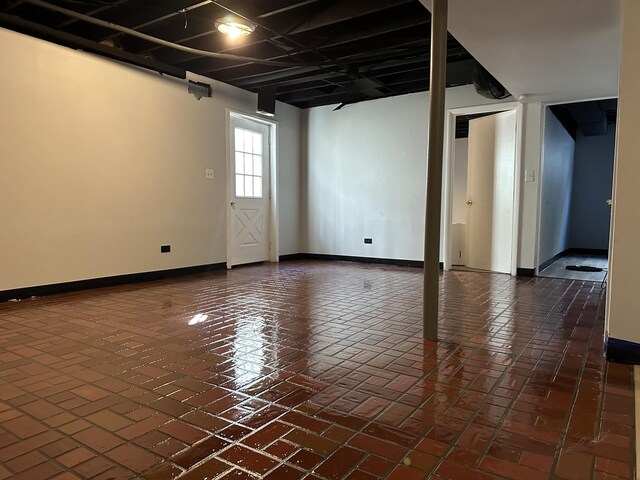 225 Pleasure Dr, Mundelein, IL 60060 - below grade area featuring baseboards and brick floor