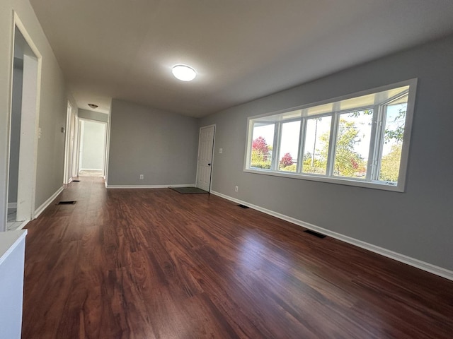 225 Pleasure Dr, Mundelein, IL 60060 - spare room featuring visible vents, baseboards, and dark wood-style floors