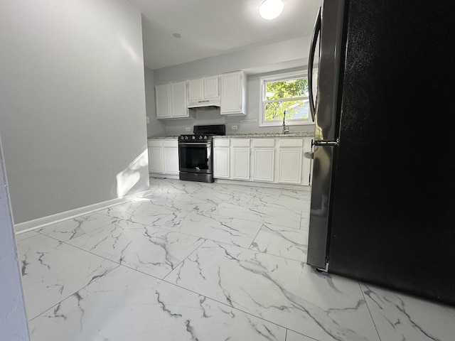 225 Pleasure Dr, Mundelein, IL 60060 - kitchen featuring baseboards, freestanding refrigerator, marble finish floor, and stainless steel gas range