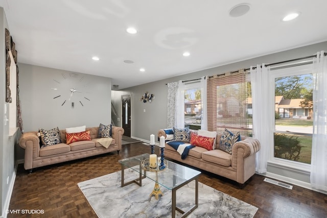 living room featuring dark parquet floors