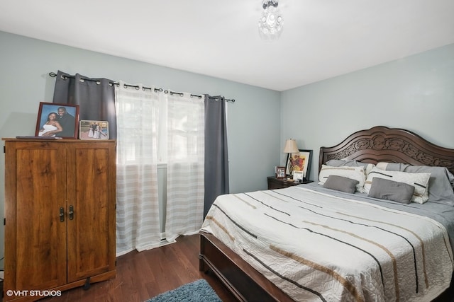 bedroom featuring dark hardwood / wood-style floors