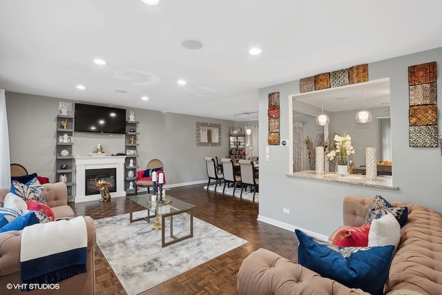 living room featuring dark parquet flooring