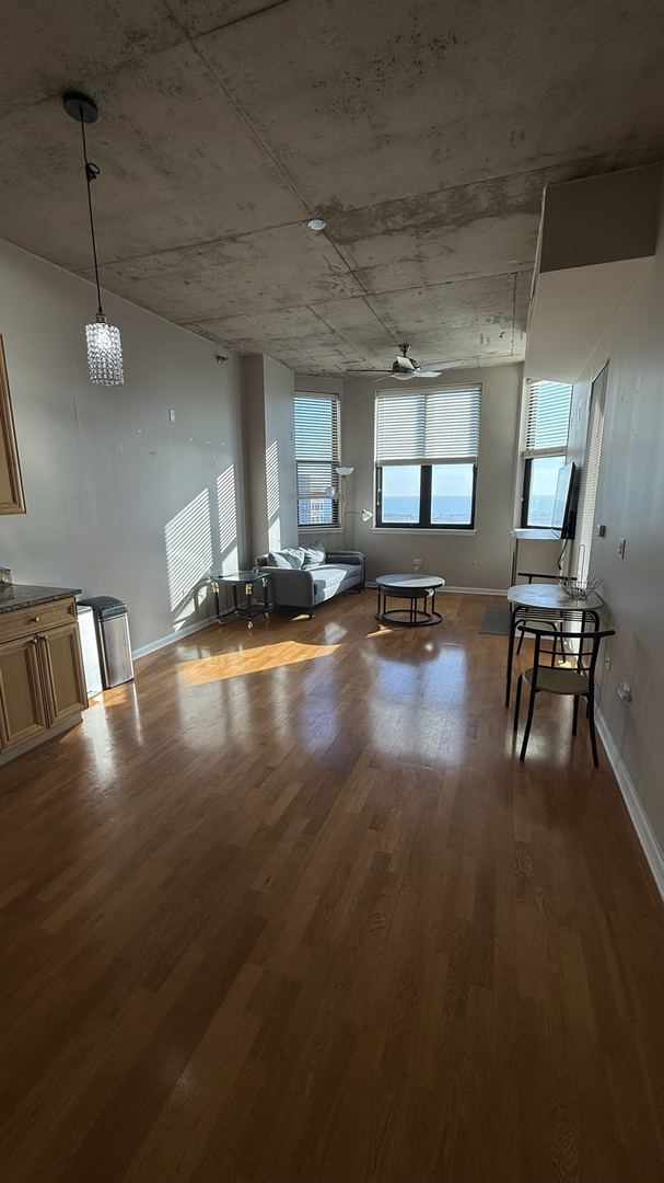 miscellaneous room featuring dark hardwood / wood-style flooring