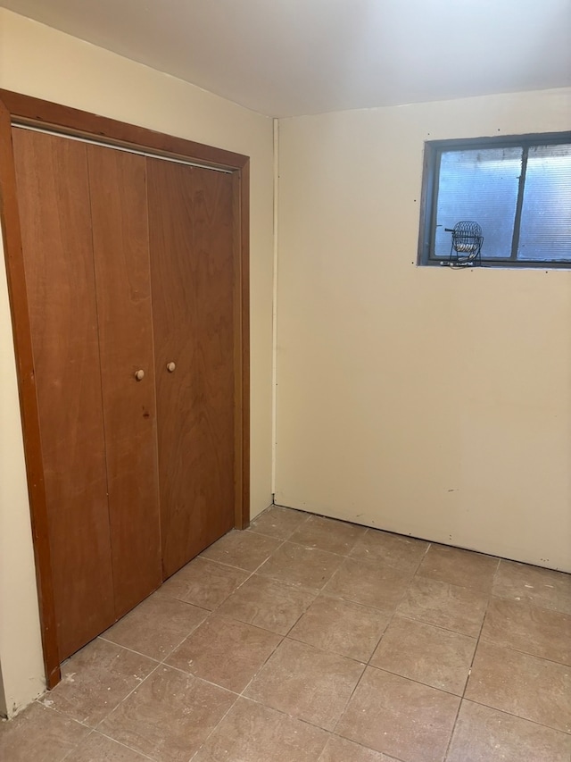 unfurnished bedroom with a closet