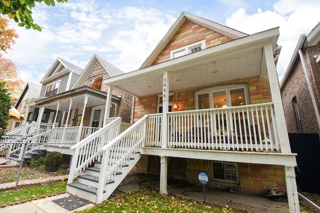 back of property featuring a porch