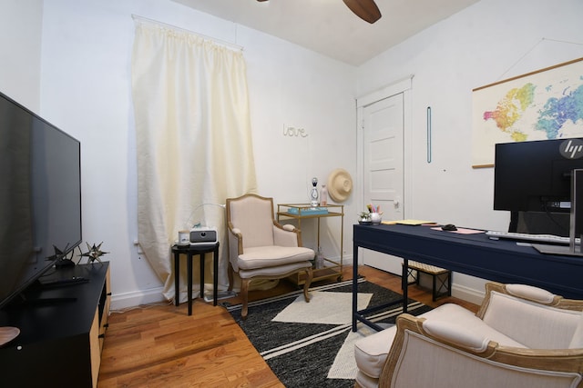 home office featuring hardwood / wood-style flooring and ceiling fan