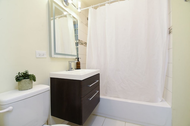 full bathroom with tile patterned flooring, vanity, shower / tub combo, and toilet