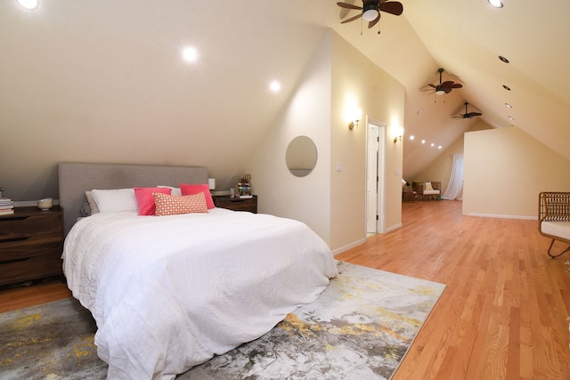 bedroom with ceiling fan, wood-type flooring, and lofted ceiling