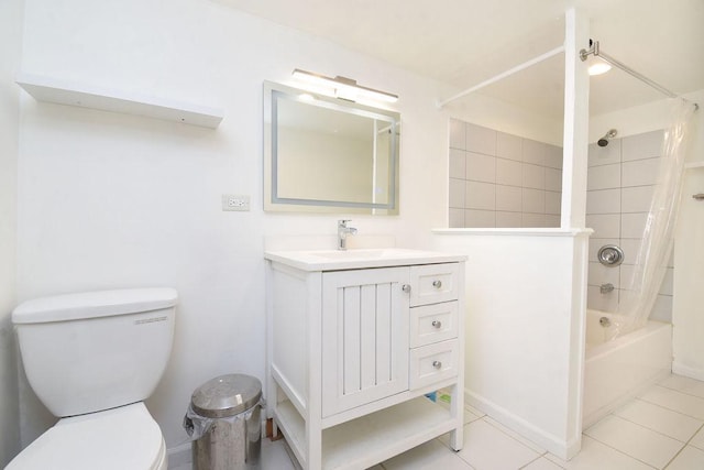 full bathroom featuring tile patterned floors, vanity, toilet, and shower / tub combo