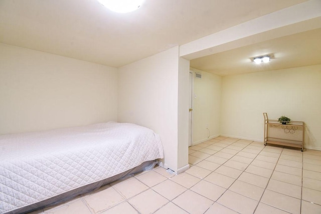 bedroom featuring light tile patterned floors