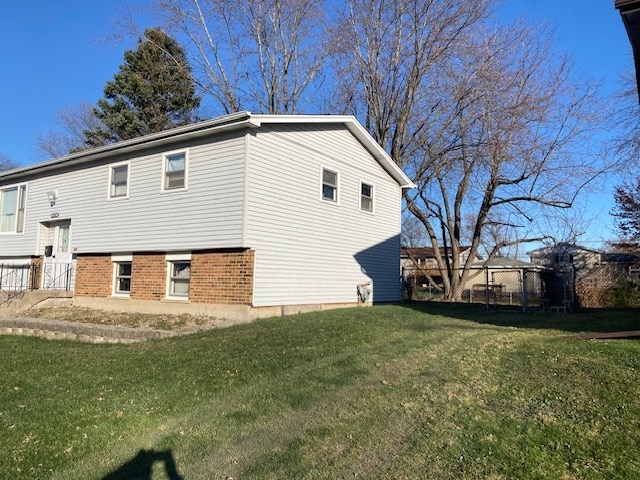 view of property exterior featuring a yard