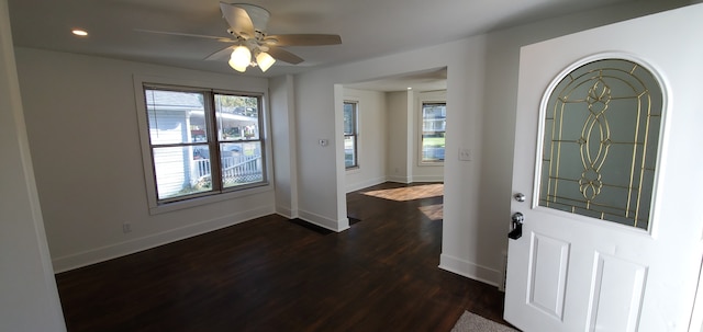 entrance foyer featuring ceiling fan and dark wood-type flooring