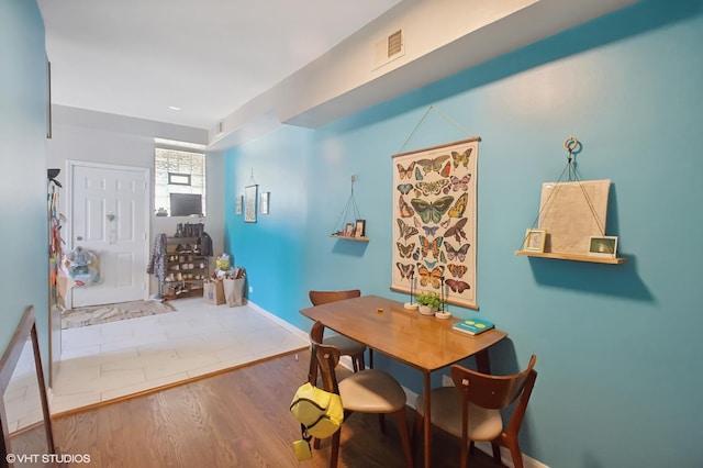 dining room with hardwood / wood-style floors