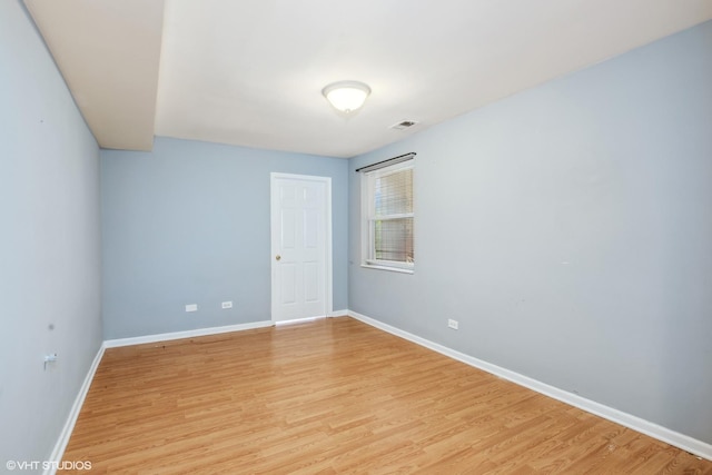 unfurnished room featuring light hardwood / wood-style floors