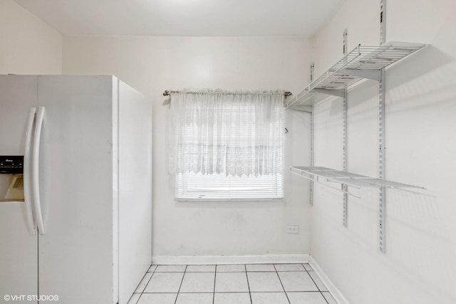 walk in closet featuring light tile patterned floors