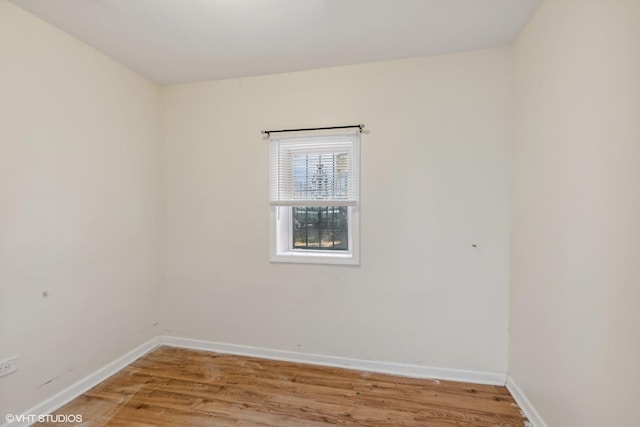 unfurnished room featuring wood-type flooring