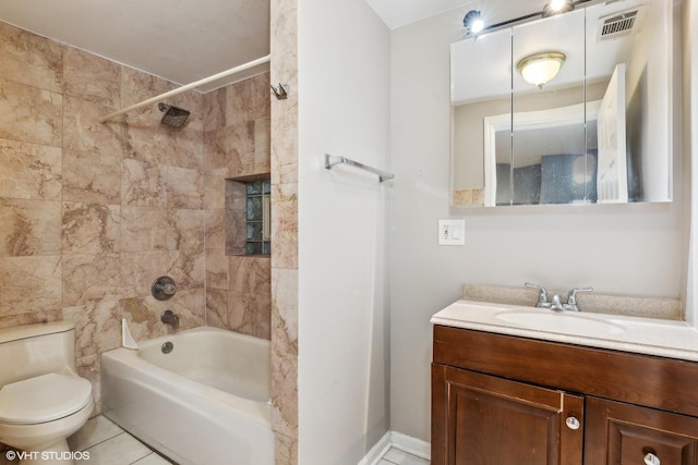 full bathroom with tile patterned flooring, vanity, toilet, and tiled shower / bath