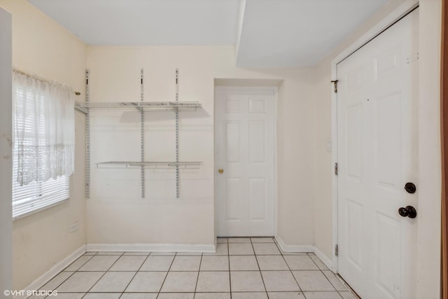 interior space with plenty of natural light and light tile patterned floors