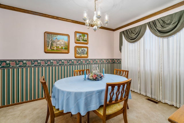 1617 Cimarron Dr, New Lenox, IL 60451 - dining area featuring light colored carpet, a chandelier, crown molding, and wallpapered walls