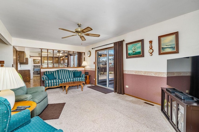 1617 Cimarron Dr, New Lenox, IL 60451 - carpeted living room with ceiling fan and a wainscoted wall