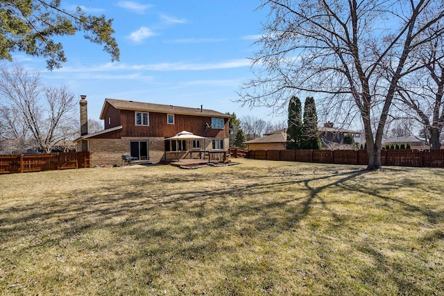 1617 Cimarron Dr, New Lenox, IL 60451 - back of house featuring a chimney, a fenced backyard, a wooden deck, and brick siding