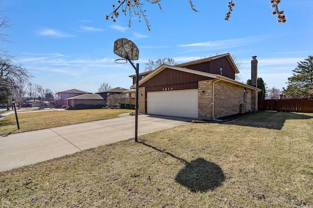 1617 Cimarron Dr, New Lenox, IL 60451 - view of side of home with concrete driveway, a garage, brick siding, and a chimney