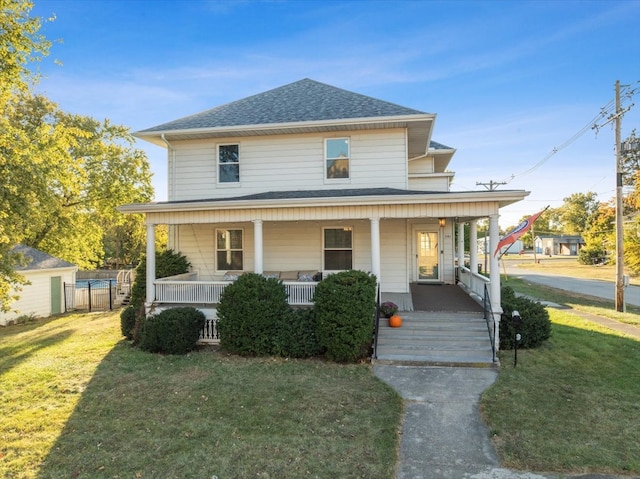 view of front facade featuring a front yard and a porch