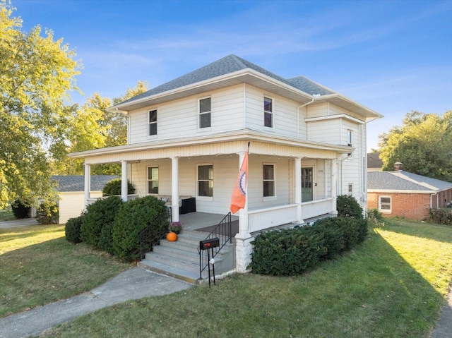 view of front of house featuring a front yard and covered porch