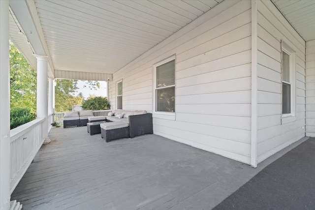 wooden deck with outdoor lounge area