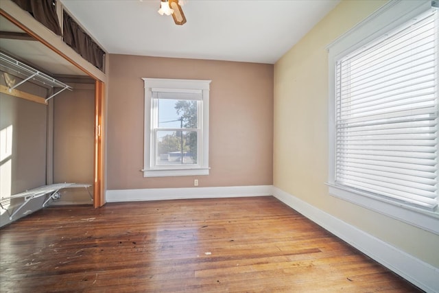 unfurnished bedroom featuring light hardwood / wood-style floors, a closet, and ceiling fan